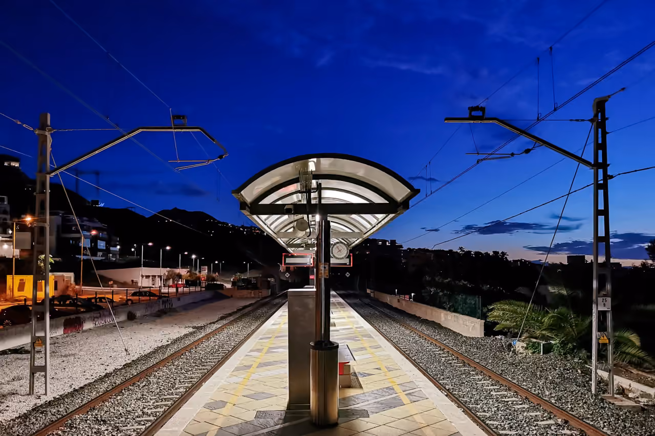 ÓLEO area photograph of the Carvajal Cercanías railway station platform at blue hour